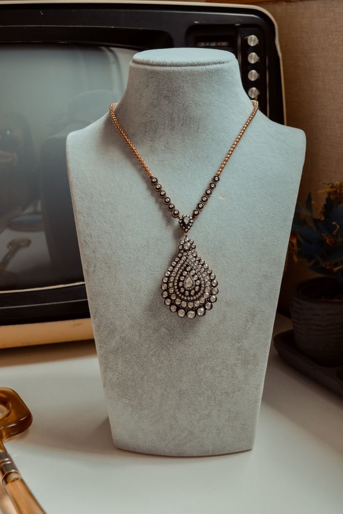 Stunning diamond necklace displayed on a mannequin stand, perfect for luxury fashion showcases.
